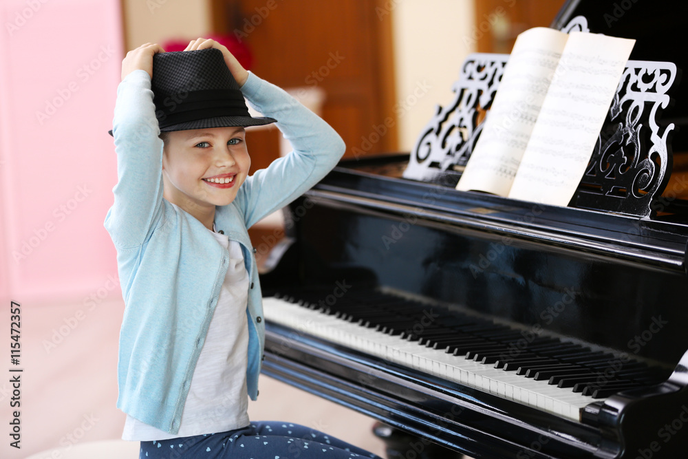 Small girl playing piano