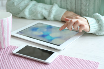 Sticker - Woman using digital tablet on table close-up