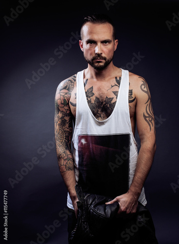 A Man With Tattooes On His Arms Silhouette Of Muscular Body