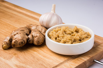 ginger and garlic paste or puree with 1 ginger and 1 garlic, closeup, selective focus, isolated