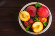 Fresh peaches on wooden background, top view, flat lay