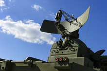 Air Defense Radar Of Military Mobile Mighty Missile Launcher System Of Green Color, Modern Army Industry, White Cloud And Blue Sky On Background 