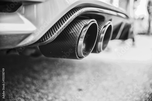 double-exhaust-pipes-of-a-modern-sports-car-black-and-white