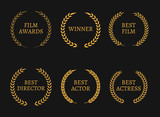 Fototapeta Dinusie - Film academy awards winners and best nominee gold wreaths on black background.