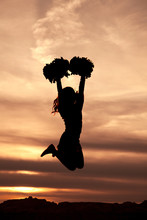 Cheerleader Silhouette Jumping In The Air