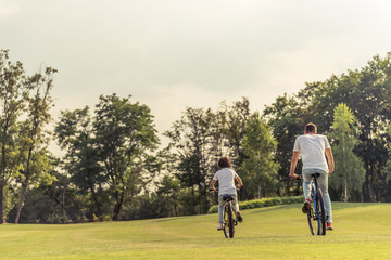 Wall Mural - Dad and son cycling