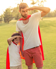 Wall Mural - Dad and son playing superheroes