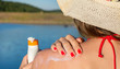 © creativefamily - Young woman putting sun lotion on summer vacation