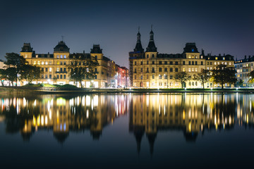 Buildings along Peblinge Sø at night, in Copenhagen, Denmark.