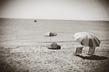 Beach Umbrellas And Chairs On A Beach In Eastham, MA Cape Cod, Vintage Look.