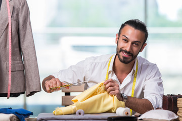 Young tailor working on new clothing design