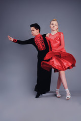 Wall Mural - Two beautiful children dancing ballroom dance sport