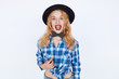 © kegfire - Beautiful girl wearing a hat and holding paper bow tie