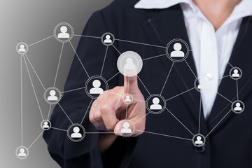 businesswoman pressing network icon.