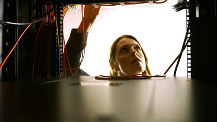 Poster - Technician looking at open server locker