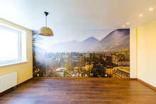 Interior Of An Empty Room In Orange Tones With A Panorama Photo Wall Mural Merano (South Tyrol, Italy)