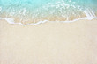 canvas print picture - Soft wave of blue ocean on the sandy beach, background.