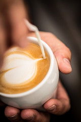 Wall Mural - Coffee with heart shape latte art serve in white cup