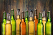 © Sensay - Group of cold wet beer bottles on the grunge background