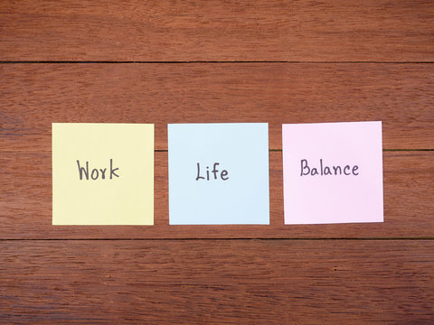 Word spell Work Life Balance on dark wood background 1