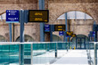 Digital timetables and platform signs at Kings Cross Station, London, UK