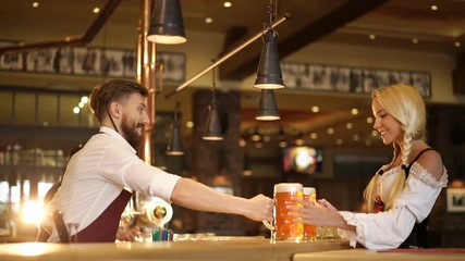 Wall Mural - Bartender and waitress in a pub