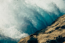 Wave Crashing Against Rock