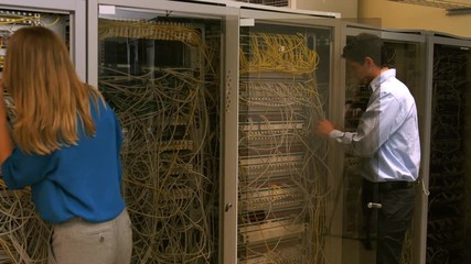 Poster - Technicians looking at open server locker