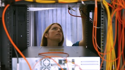 Poster - Technician looking at open server locker
