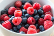 Bowl of fresh blueberries and raspberries