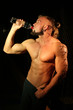 © kazanovskyiphoto - Young handsome muscular man with bottle of water