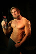 © kazanovskyiphoto - Young handsome muscular man with bottle of water