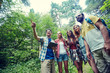 © Syda Productions - happy friends with backpacks and tablet pc hiking