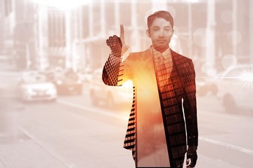 Poster - composite image of stern asian businessman pointing