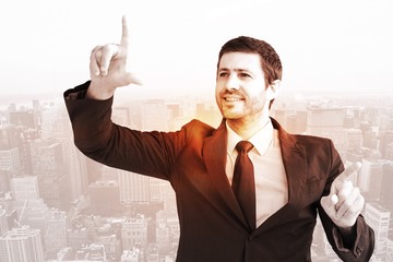 Canvas Print - Composite image of happy businessman pointing with fingers