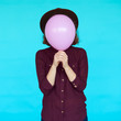 © kegfire - Young hipster woman holding balloon over her face