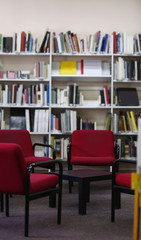 Wall Mural - Modern library interior with red chairs