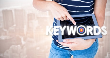 Poster - Composite image of woman using tablet pc 