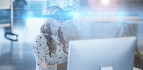 Poster - Businesswoman using virtual reality headset in office