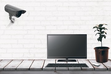 Poster - Composite image of a computer over a desk 