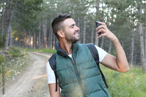 Fotografija Surprised man looking at his mobile phone