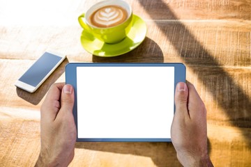 Poster - Composite image of cropped image of person holding tablet
