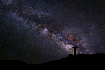 Wall Mural - landscape with milky way, night sky with stars and silhouette of