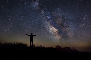 Wall Mural - landscape with milky way, night sky with stars and silhouette of