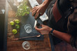 © Jacob Lund - Barman making cocktail at the counter
