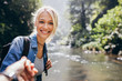 © Jacob Lund - Woman enjoying a hike in nature with her boyfriend