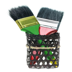 two paintbrushes with black basket isolated on white