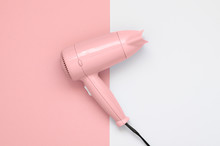 Pink Hair Dryer On Pink And White Background