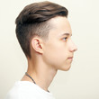 © Pavel Kubarkov - Young man profile face over gray background