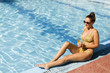 © BGStock72 - Woman by the pool in summer